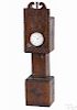 Sailor's carved hardwood clock-form watch hutch, 19th c., decorated with an anchor