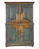 Painted pine two-part stepback cupboard, late 18th c., retaining a scrubbed blue surface