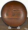 Pennsylvania redware pie plate, 19th c., with slip decoration of a bird, 6 5/8'' dia.