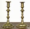 Pair of English Queen Anne brass candlesticks, mid 18th c., with scalloped bases, 9 1/4'' h.