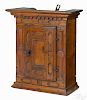 Diminutive pine hanging cupboard, late 18th c., with a dentil molded cornice over a case and door