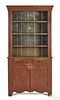 Painted pine stepback cupboard, early 19th c., with an open top and an old red surface, 79 3/4'' h.