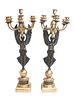 * A Pair of Gilt and Patinated Bronze Six-Light Figural Candelabra Height 26 3/4 inches.
