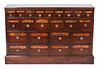 A Twenty-Three Drawer Apothecary Cabinet Height 33 x width 50 1/2 x depth 10 inches.