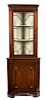 * A Chippendale Style Mahogany Corner Cabinet Height 71 1/4 x width 25 1/2 inches.