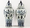 PAIR OF LARGE BLUE AND WHITE CHINESE PORCELAIN CAPPED PALACE URNS