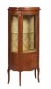 French Louis XV Style Inlaid Ormolu Mounted Carved Walnut Vitrine, 20th c., with a sloping shaped plinth top over a door with a curved glass upper pan