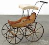 Victorian child's stenciled wood doll pram, late 19th c., 27'' h., 29'' l.