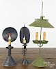 Three contemporary tin table lamps, tallest - 24''. Provenance: Barbara Hood's Country Store