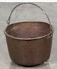 Large copper bucket, 19th c. with an iron swing handle, 11 1/2'' h., 17'' dia.