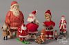 Santa Claus figures, 20th c., to include a Japanese wind-up with a book