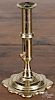 English Queen Anne brass slide ejector candlestick, mid 18th c., 6 5/8'' h.