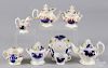 Two Gaudy Welsh child's partial tea services, to include a Grape pattern teapot, a creamer