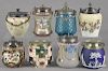 Eight glass and porcelain biscuit jars, 19th/20th c., to include Wedgewood, majolica, Gaudy Welsh