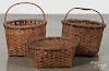 Three split oak baskets, largest - 13 1/2'' h., 12'' w.