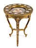 A Louis XV Style Porcelain and Gilt Bronze Mounted Giltwood Gueridon Height 29 x diameter 21 1/2 inches.