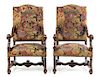 * A Pair of Louis XIV Style Walnut Fauteuils Height 47 1/2 x width 26 x depth 27 inches.