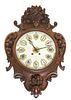 A French Oak Wall Clock Length 28 1/2 inches.