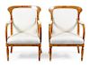 A Pair of Biedermeier Ash and Amaranth Armchairs Height 34 inches.