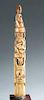 Ivory tusk carving with figures