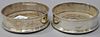 Pair of English silver wine coasters with wood bases. dia. 5in.