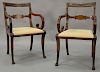 Pair of Duncan Phyfe armchairs with wheat carved backs having fluted scrolled arms all set on hairy paw feet front legs, attributed ...