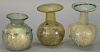 Three Roman Empire small glass flasks or sprinkler flasks, 3rd to 5th century A.D. ht. 3in. to 4in.