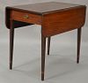 Federal mahogany drop leaf Pembroke table with drawer and inlay set on square tapered legs. ht. 29in., top closed: 19" x 33", top op...