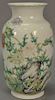 Chinese famille rose porcelain vase with hand painted blossoming lotus and wild flowers, seal mark on bottom. ht. 12 1/4in.