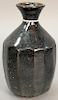 Stoneware monochrome lobed vase, Song Dynasty, with overall black glaze and everted rim ht. 7 1/2in.