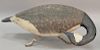 Large Prince Edward Island, Canada, carved wood goose decoy with glass eyes and painted with brown, black, and white plumage, set on...