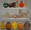 Fifteen glass, crystal, and quartz snuff bottles, some possibly Peking glass.  ht. 1 1/4in. to 2 3/4in.