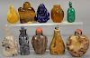 Ten carved snuff bottles including lapis, tiger eye, agate, hardstone, etc.  ht. 2 1/4in. to 2 3/4in.