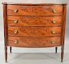 Sheraton mahogany bowed front chest having turret corners over fluted columns with four bowed front drawers, circa 1830. ht. 42in., ...