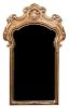 A Rococo Style Giltwood Mirror Height 43 1/2 x width 25 1/2 inches.