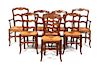 A Set of Eight Ladderback Dining Chairs Height 38 1/4 inches.