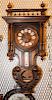 * A French Walnut Wall Clock. Height overall 36 inches.