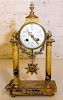 * A Marble and Gilt Metal Mantle Clock. Height 15 inches.