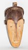 * A Gabon Wood Mask, Ngi Society. Height 19 1/4 inches.