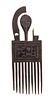* An Ashanti Carved Wood Comb. Height 9 x width 3 1/4 x depth 1/4 inches.