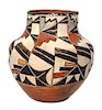 An Acoma Polychrome Olla Height 8 1/2 x 8 1/2 inches.