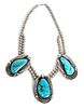 A Silver and Turquoise Necklace Length of necklace 26 inches.