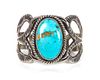 A Navajo Tooled Sand-Cast Silver and Turquoise Cuff Bracelet Length 5 1/2 x opening 1 1/4 x width 1 3/4 inches.