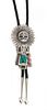 A Navajo Silver, Turquoise and Coral Kachina Bolo Height 4 x width 2 1/8 inches.