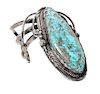 A Monumental Southwestern Silver and Turquoise Bracelet Length 5 3/4 x opening 1 1/4 x width 4 inches.