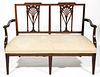 AMERICAN FEDERAL CARVED MAHOGANY RACKET-BACK SETTEE
