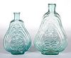 GIX-11 AND GIX-34 EMBOSSED SCROLL FLASKS, LOT OF TWO