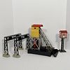 A Vintage Lionel O Gauge 97 Coal Elevator And Three Other Accessories, All unboxed, the Coal Elevator featuringa yellow and red tinplate loft with a s