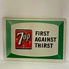 Two 7 Up "First Against Thirst" Advertising Signs, Pair of colorful rectangular 1960s green, red and white embossedtin hanging advertising signs, both