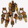 Group Of Thirteen Vintage Anri And Similar Hand Carved Wooden Items, Including eight figural bottle stoppers, seven articulated, some with moveable mo